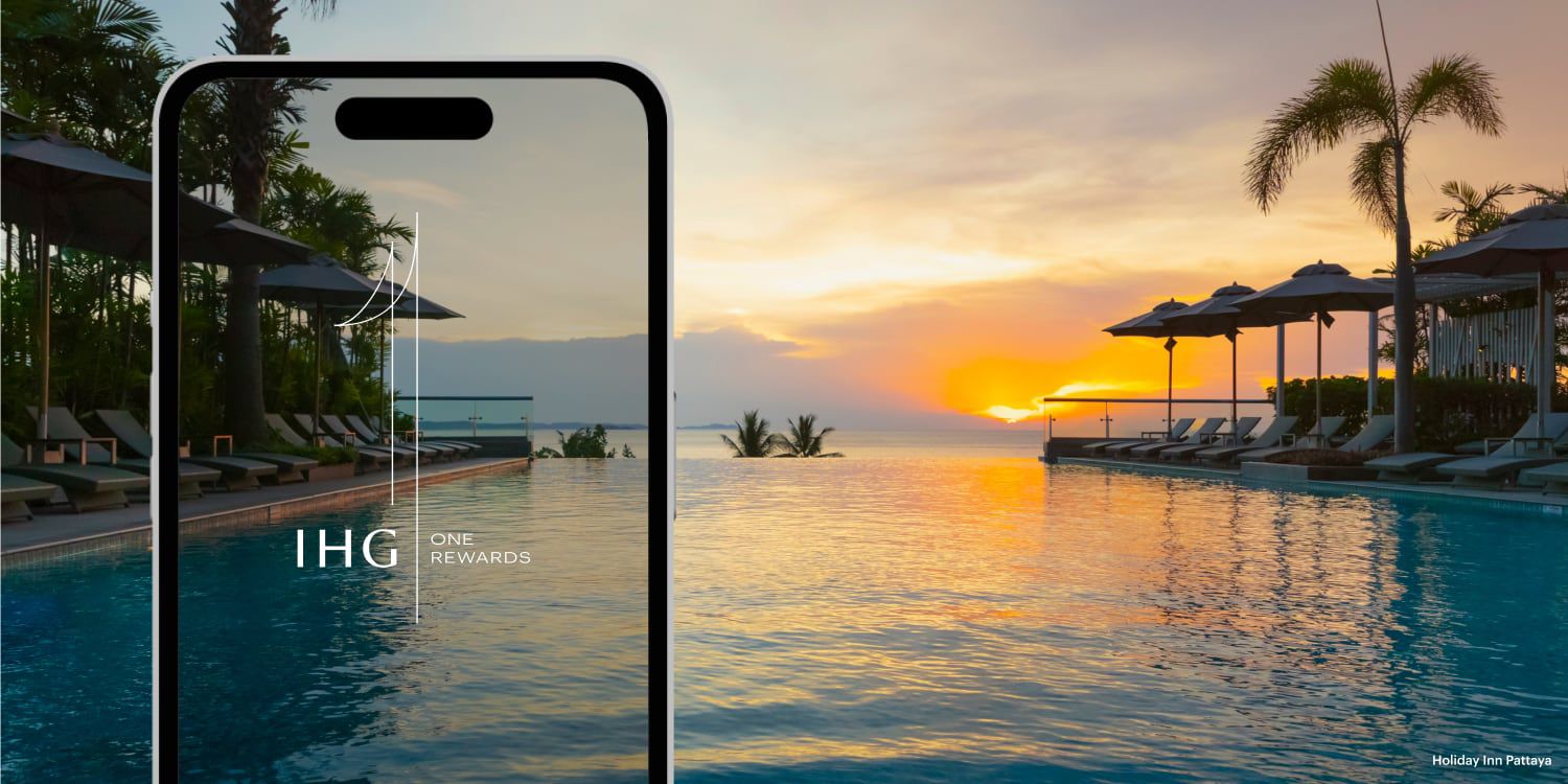 Lounge chairs lining a swimming pool, the perfect place for last-minute travel